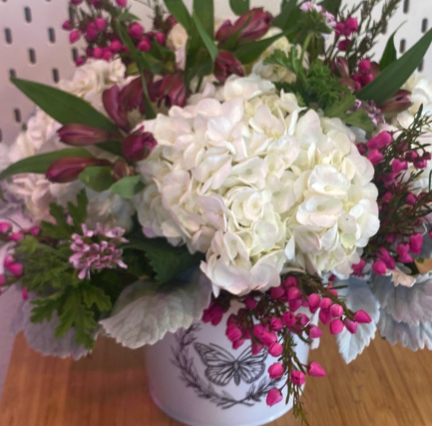 mothers day flowers in a butterfly tin