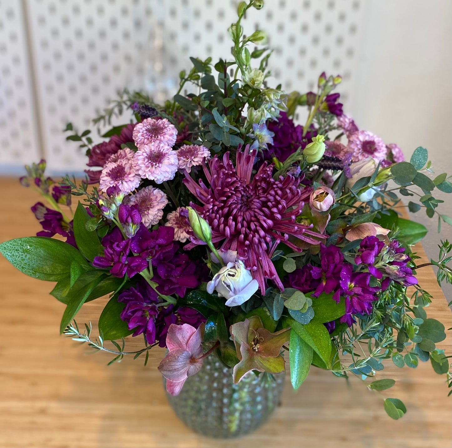 Beautiful vase arrangement of flowers such as mums, stock, lisianthus, larkspur in shades of lavender and purple. locally sourced flowers delivered in woodland, davis, esparto, knight's landing, valentines day flowers sustainable floristry in yolo county. woman owned